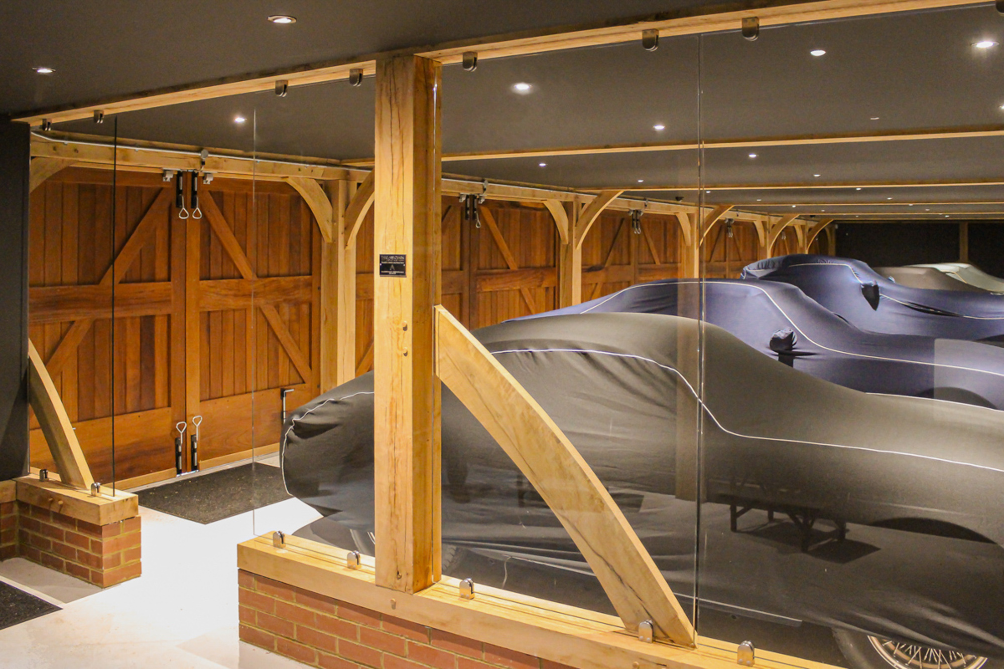 Internal Image Of 5 Bay Garage With TImber Fram and Glass Partitions